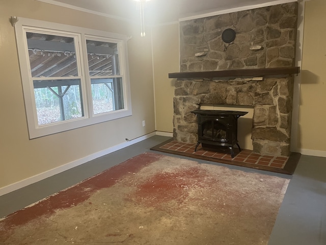 unfurnished living room with a wood stove