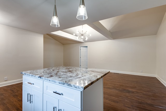 kitchen featuring a kitchen island, white cabinetry, dark hardwood / wood-style floors, hanging light fixtures, and a chandelier