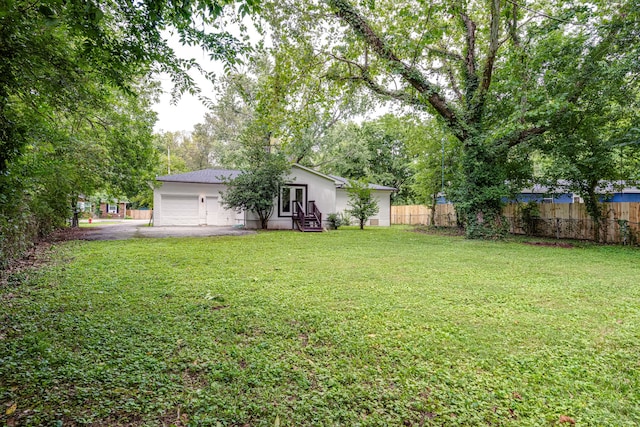 view of yard with a garage