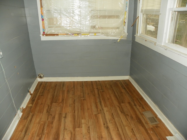 spare room featuring dark wood-type flooring