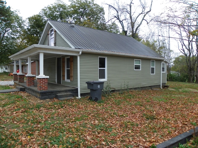 view of property exterior with a porch