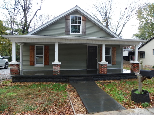 view of front of property featuring covered porch