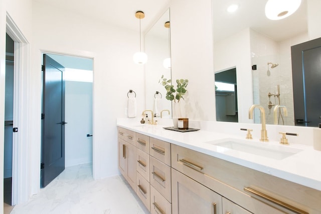 full bathroom with marble finish floor, double vanity, a sink, and a shower stall