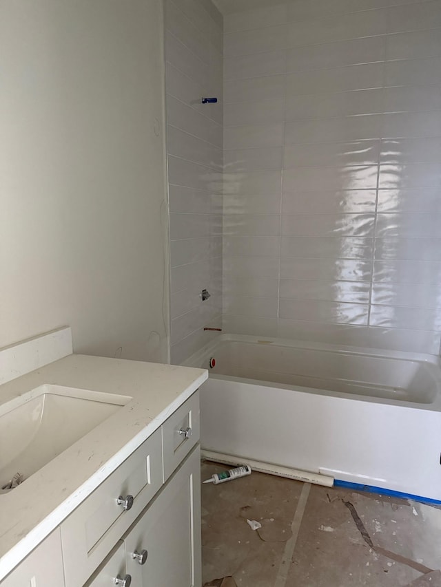 bathroom featuring bathing tub / shower combination and vanity