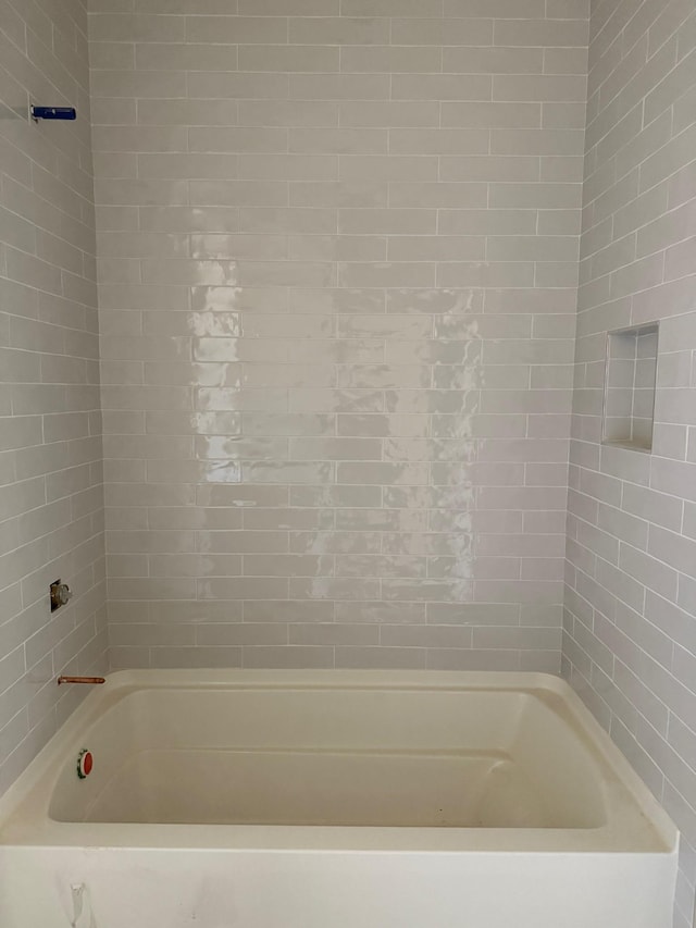 full bath featuring bathtub / shower combination