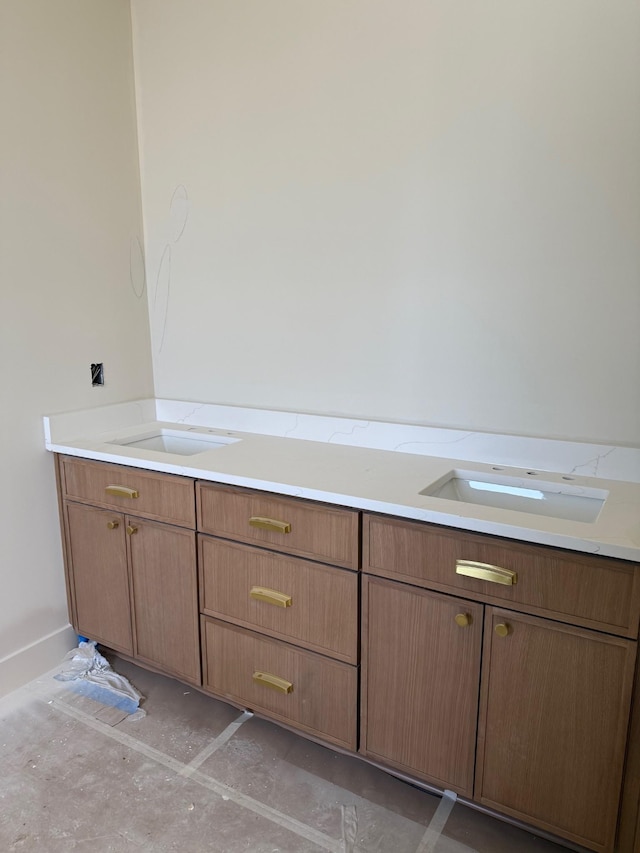 bathroom featuring unfinished concrete flooring and a sink