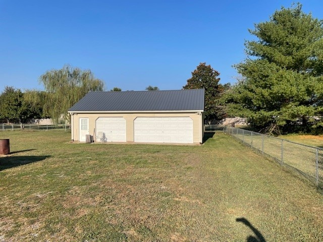 garage with a yard