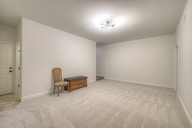 sitting room featuring light colored carpet