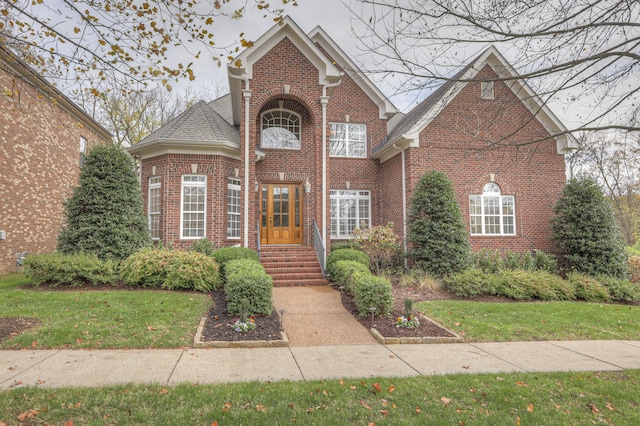 view of property with a front lawn