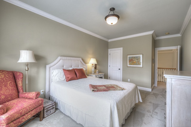 bedroom with ornamental molding and light colored carpet