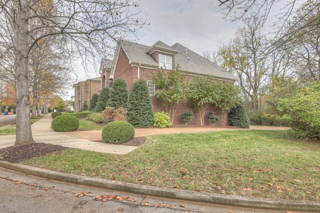 view of home's exterior featuring a yard