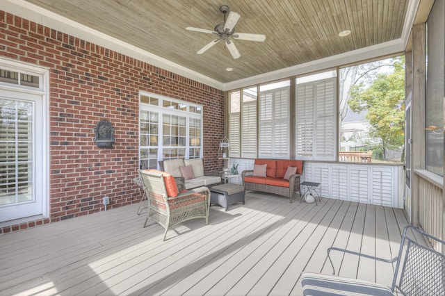 sunroom / solarium with wooden ceiling and ceiling fan