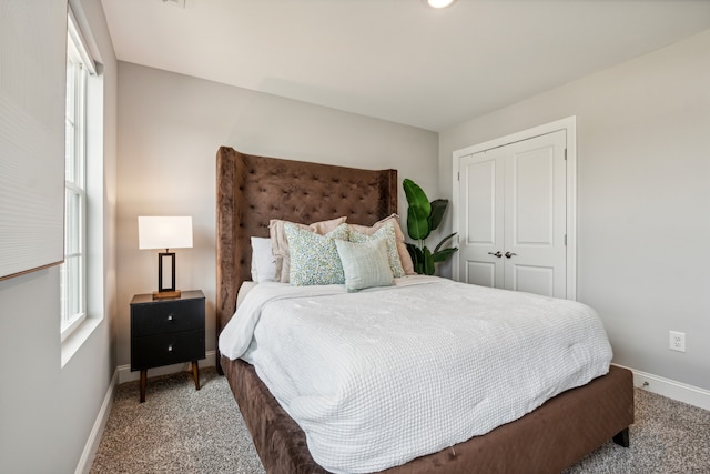 bedroom with carpet flooring and a closet