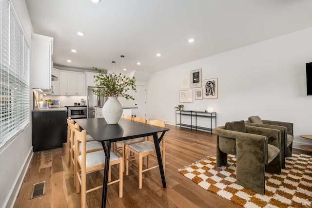 dining area featuring hardwood / wood-style floors