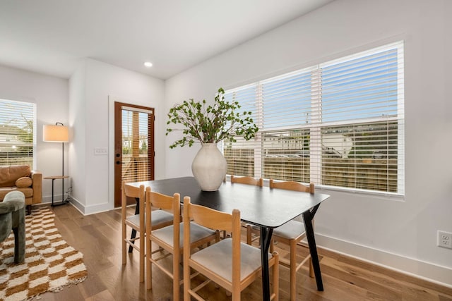 dining area with hardwood / wood-style flooring