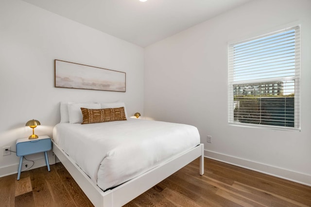 bedroom featuring dark hardwood / wood-style flooring