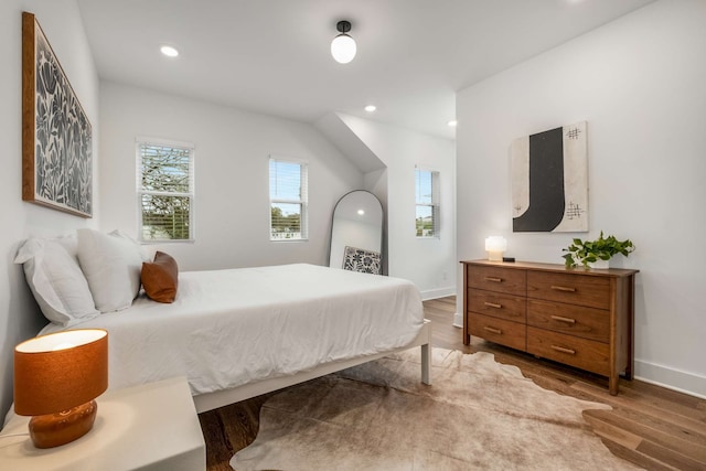 bedroom with hardwood / wood-style floors