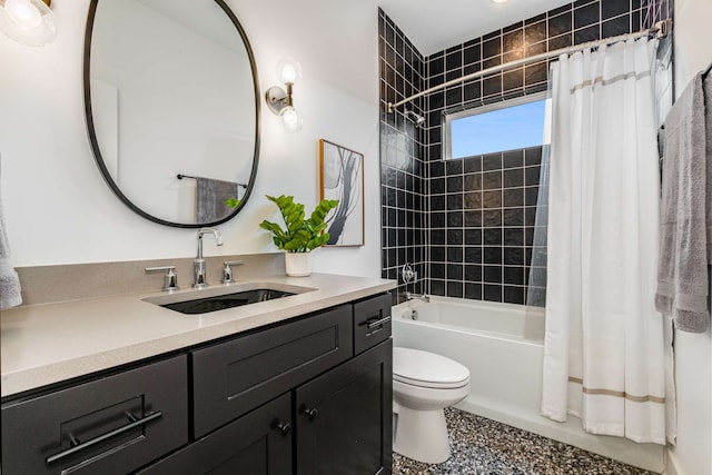 full bathroom featuring vanity, toilet, and shower / bath combo with shower curtain