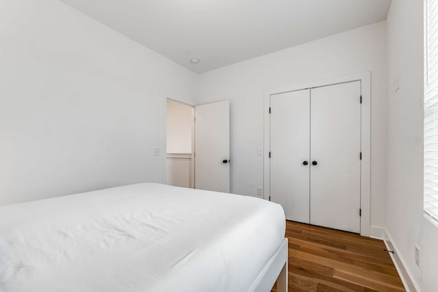 bedroom featuring hardwood / wood-style flooring and a closet