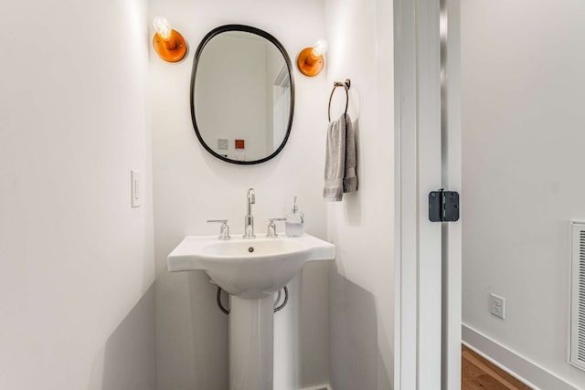 bathroom featuring hardwood / wood-style flooring