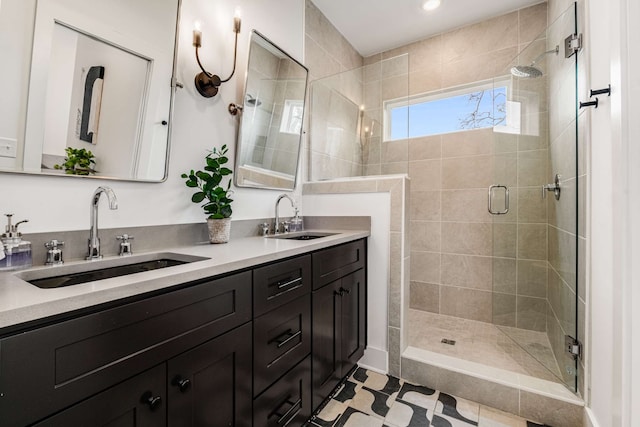 bathroom with tile patterned flooring, vanity, and a shower with shower door