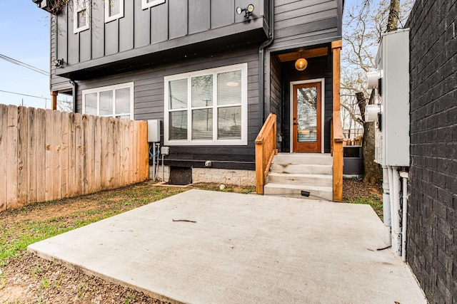 property entrance with a patio area