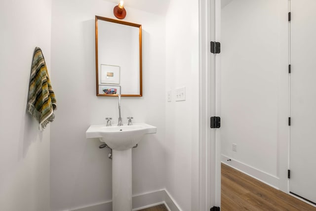 bathroom with hardwood / wood-style floors