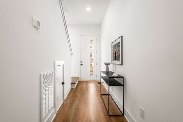 hallway featuring hardwood / wood-style flooring