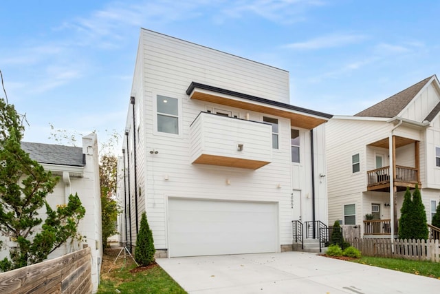 contemporary house featuring a balcony and a garage