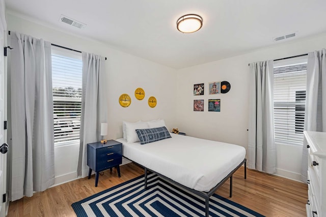 bedroom with light hardwood / wood-style flooring