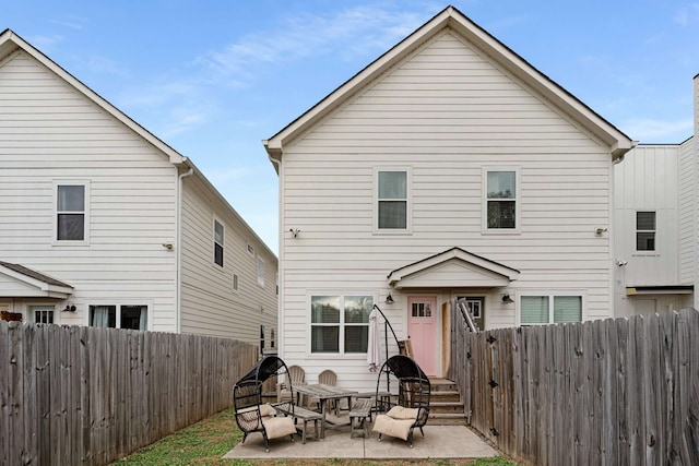 back of house with a patio area