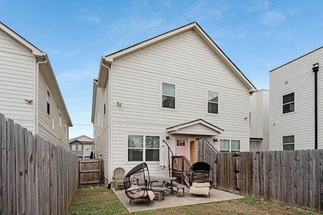 rear view of property featuring a patio area