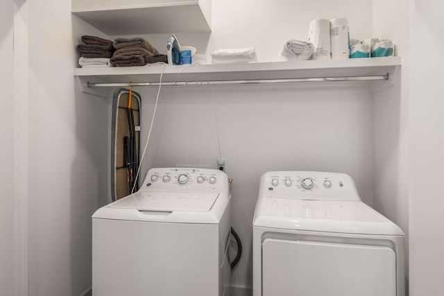 washroom featuring independent washer and dryer