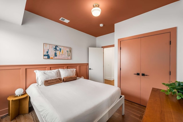 bedroom featuring hardwood / wood-style flooring and a closet