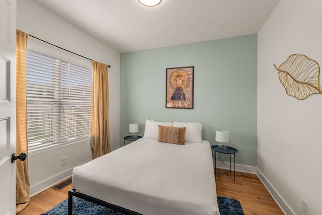 bedroom with light wood-type flooring