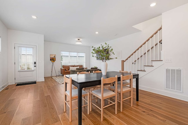 dining area featuring light wood-type flooring