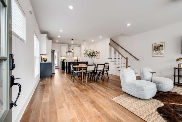 dining area featuring light hardwood / wood-style floors and sink