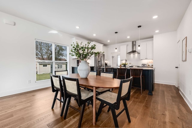 dining area with light hardwood / wood-style flooring