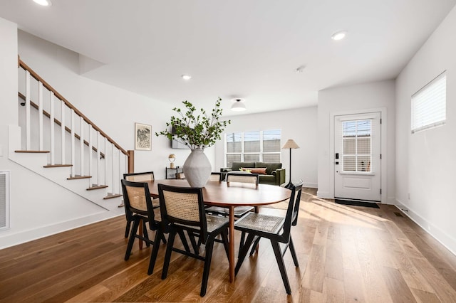 dining space featuring hardwood / wood-style floors