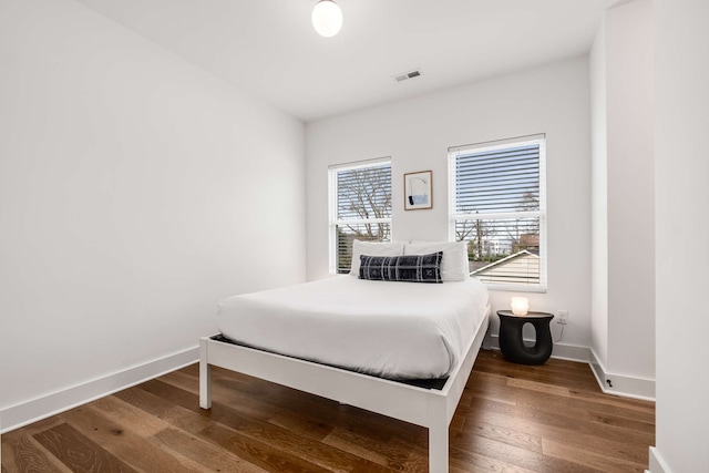 bedroom featuring dark hardwood / wood-style flooring