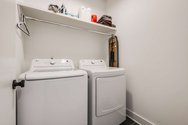 laundry area with washing machine and dryer