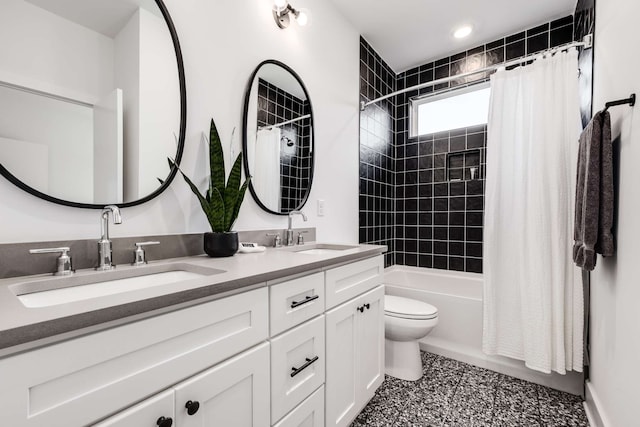 full bathroom featuring vanity, toilet, and shower / bathtub combination with curtain