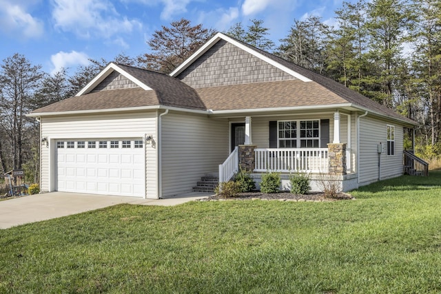 view of front facade with a garage, a front yard, and a porch