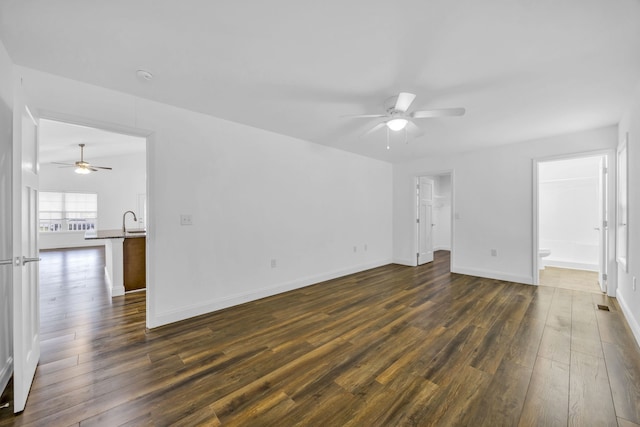 interior space featuring dark wood-type flooring, sink, and ceiling fan