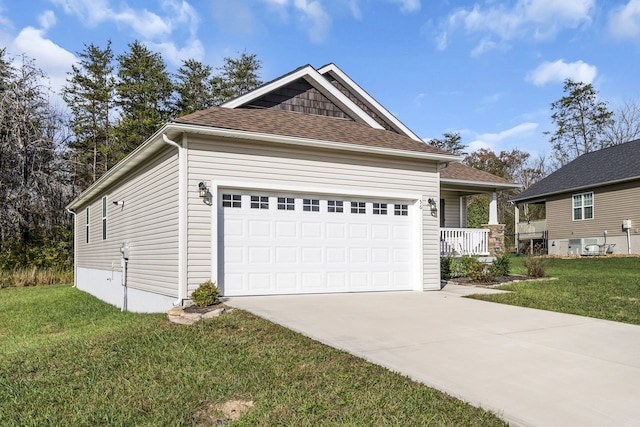 view of front of house with a garage and a front lawn