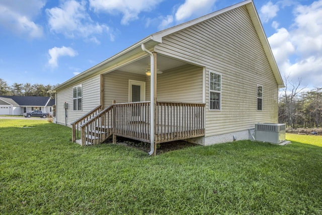 exterior space featuring a wooden deck and a yard