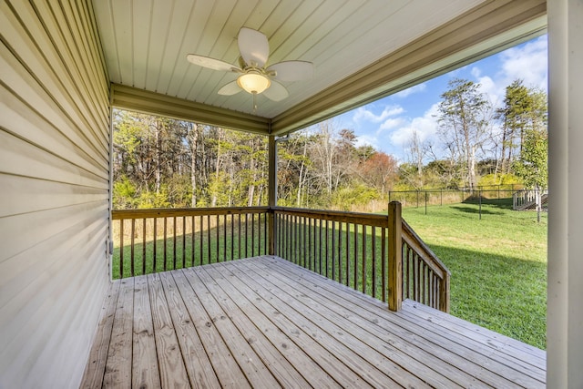 wooden terrace with a yard and ceiling fan