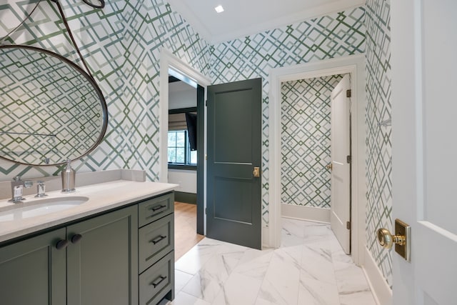 bathroom with vanity and crown molding