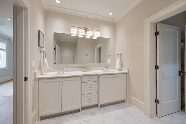 bathroom with vanity and ornamental molding