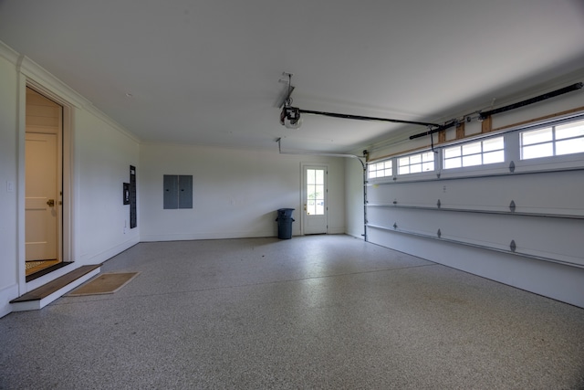 garage featuring a garage door opener and electric panel